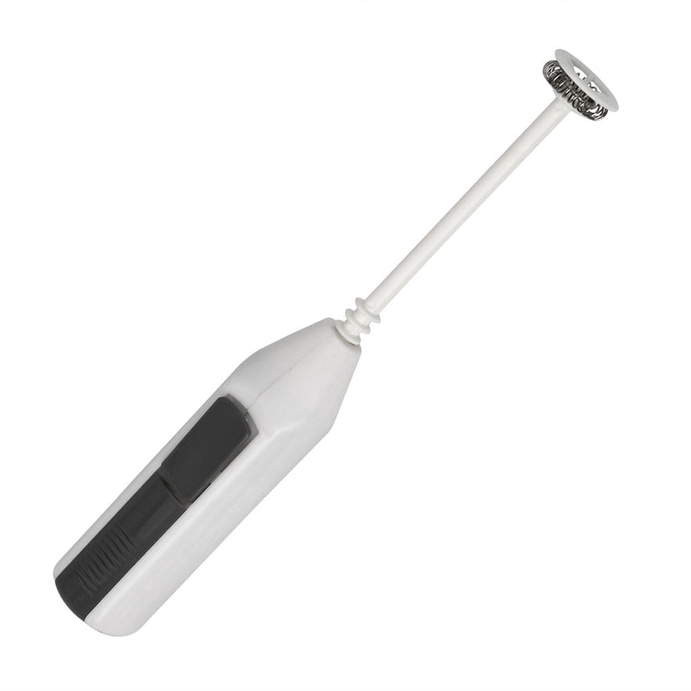 Handheld milk frother held in hand