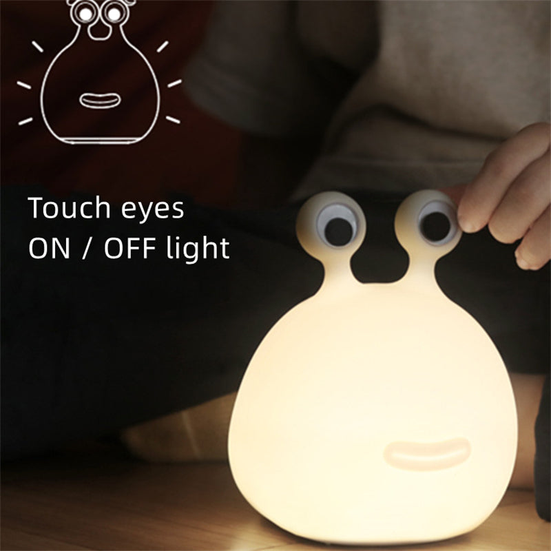 Slug night light glowing on a nightstand