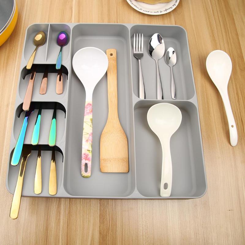 Cutlery organiser holding spoons, forks and knives