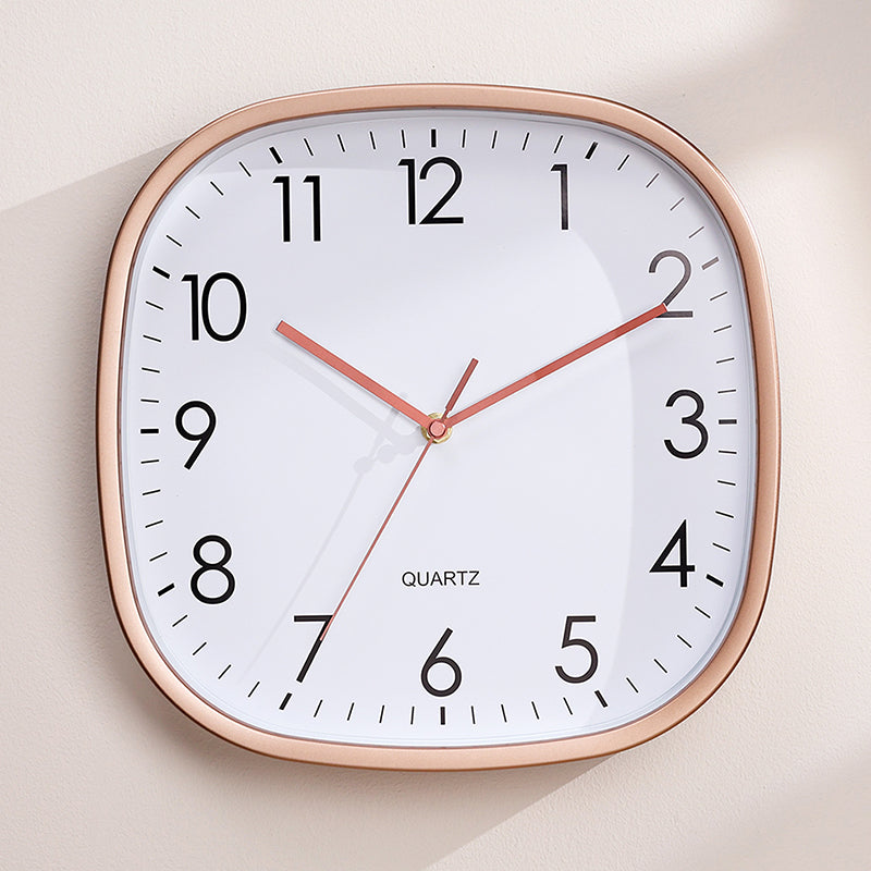 Silent luminous wall clock with rose gold frame