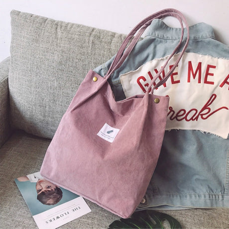 Corduroy tote bag carried on the shoulder