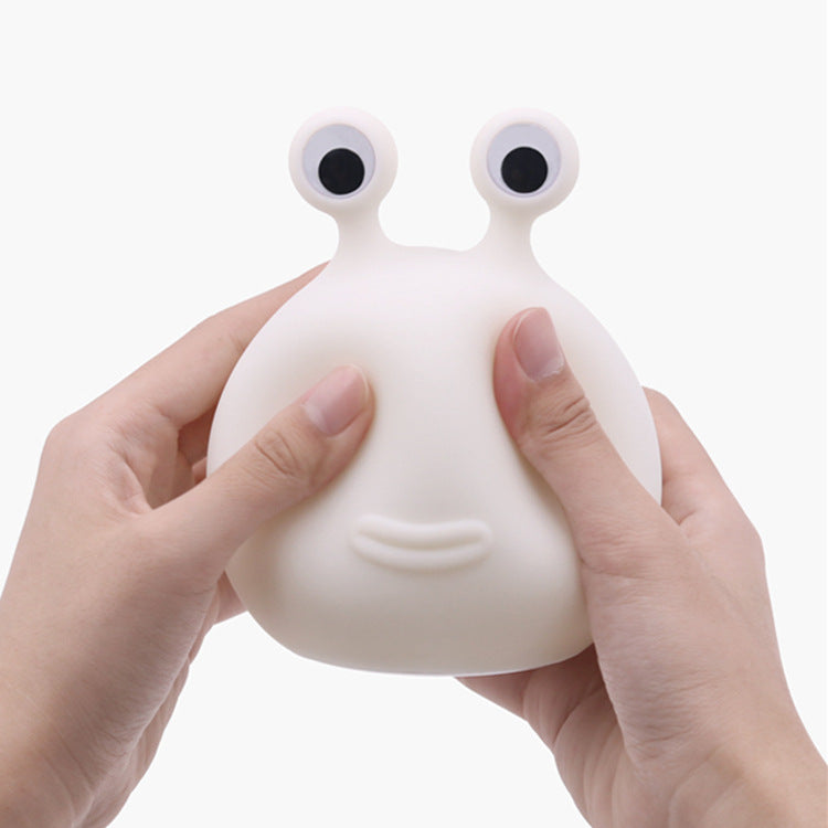 Soft silicone slug night light held in hand