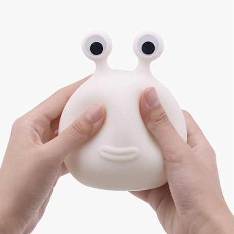 Soft silicone slug night light held in hand