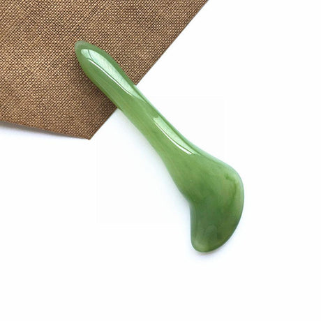 Jade roller being used on the face