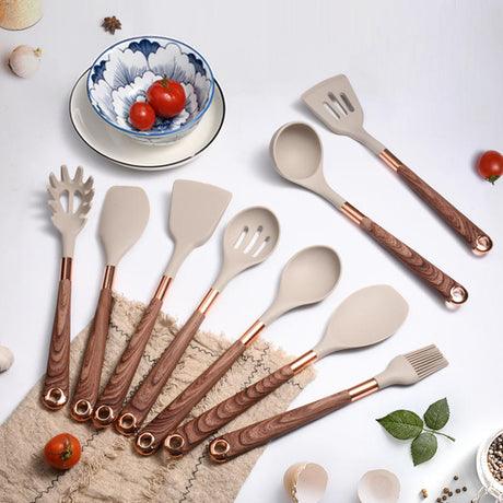 Silicone utensils with wooden handles in a holder