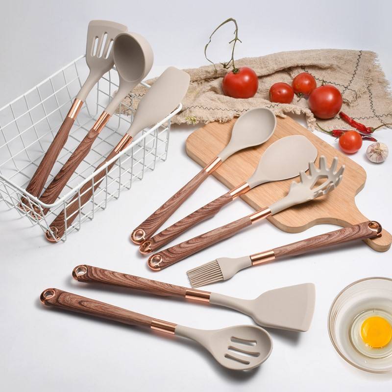 Full range of silicone cooking utensils laid out