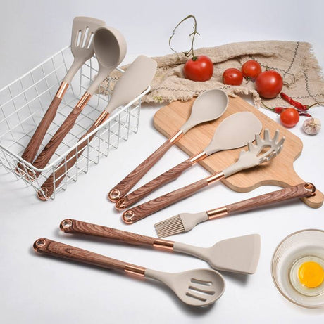 Full range of silicone cooking utensils laid out