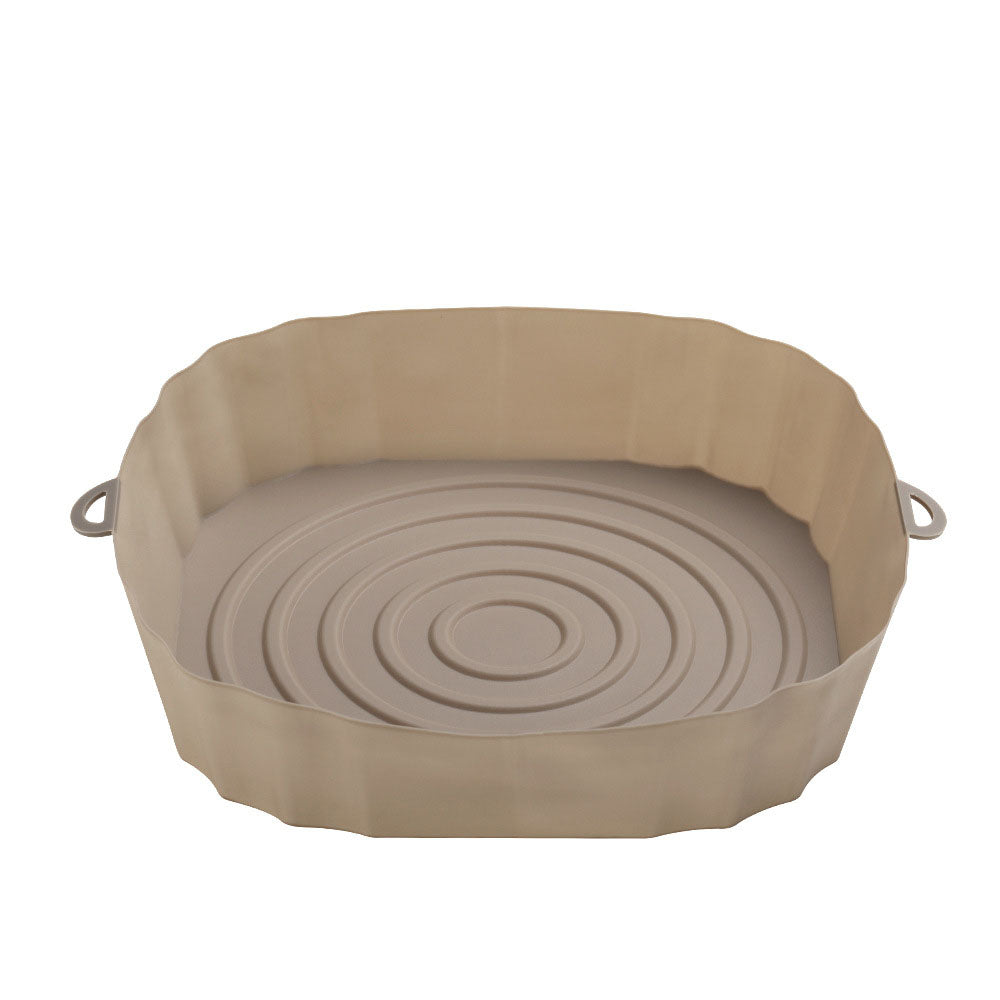 Air fryer liner with food cooking on it