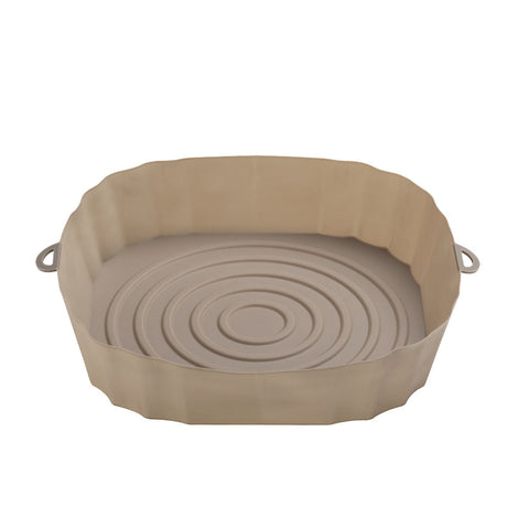 Air fryer liner with food cooking on it
