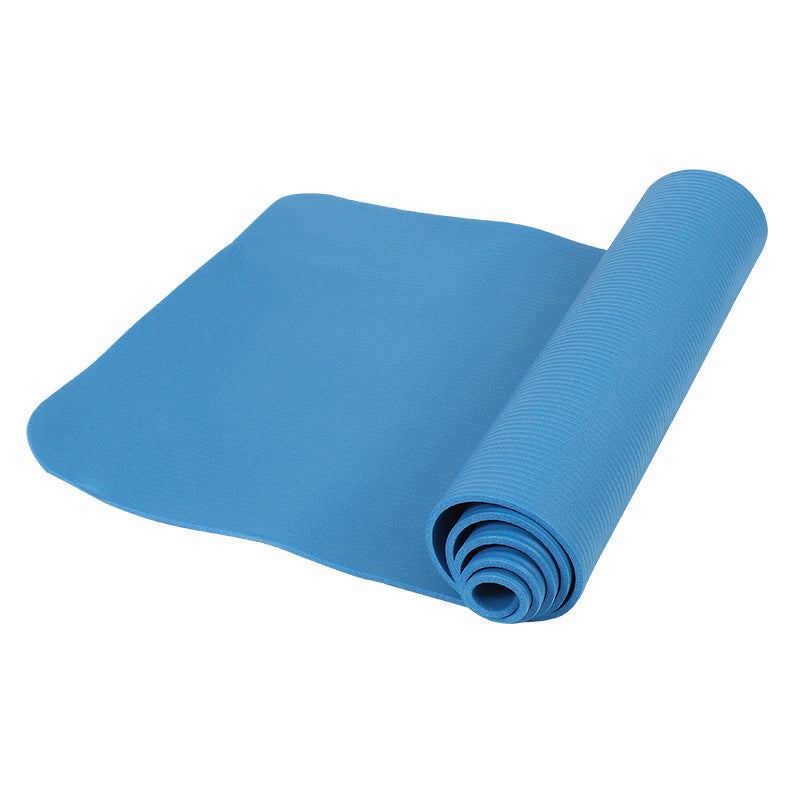 Yoga mat rolled out on the floor