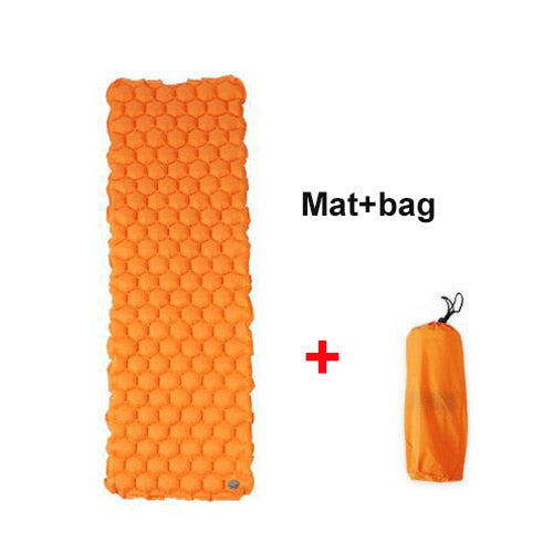 Person inflating the camping sleeping mat