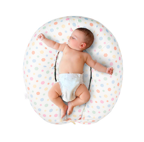 Baby supported on the nursing pillow