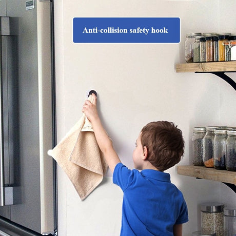Adhesive hook holding a towel on a wall