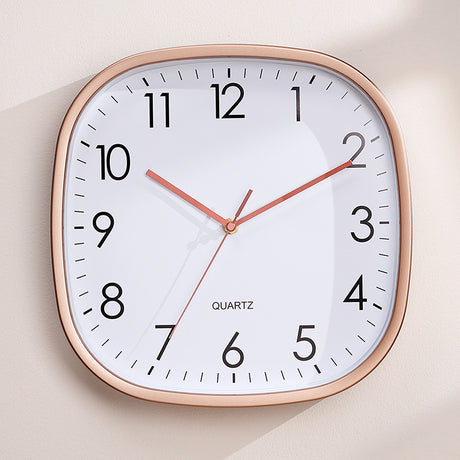 Silent luminous wall clock with rose gold frame