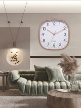 Luminous wall clock shown by day and night