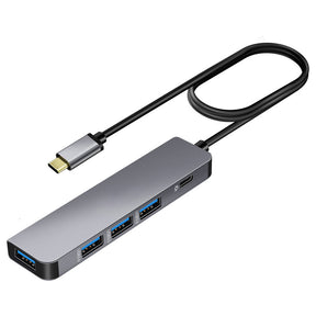 Compact USB-C hub held in hand