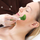 Jade roller and gua sha stones close-up